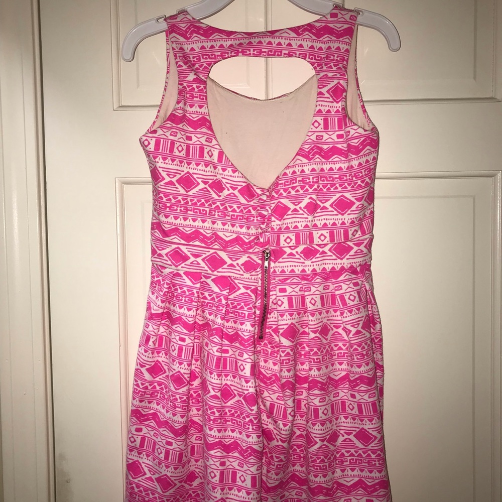 Pink and white patterned dress.
